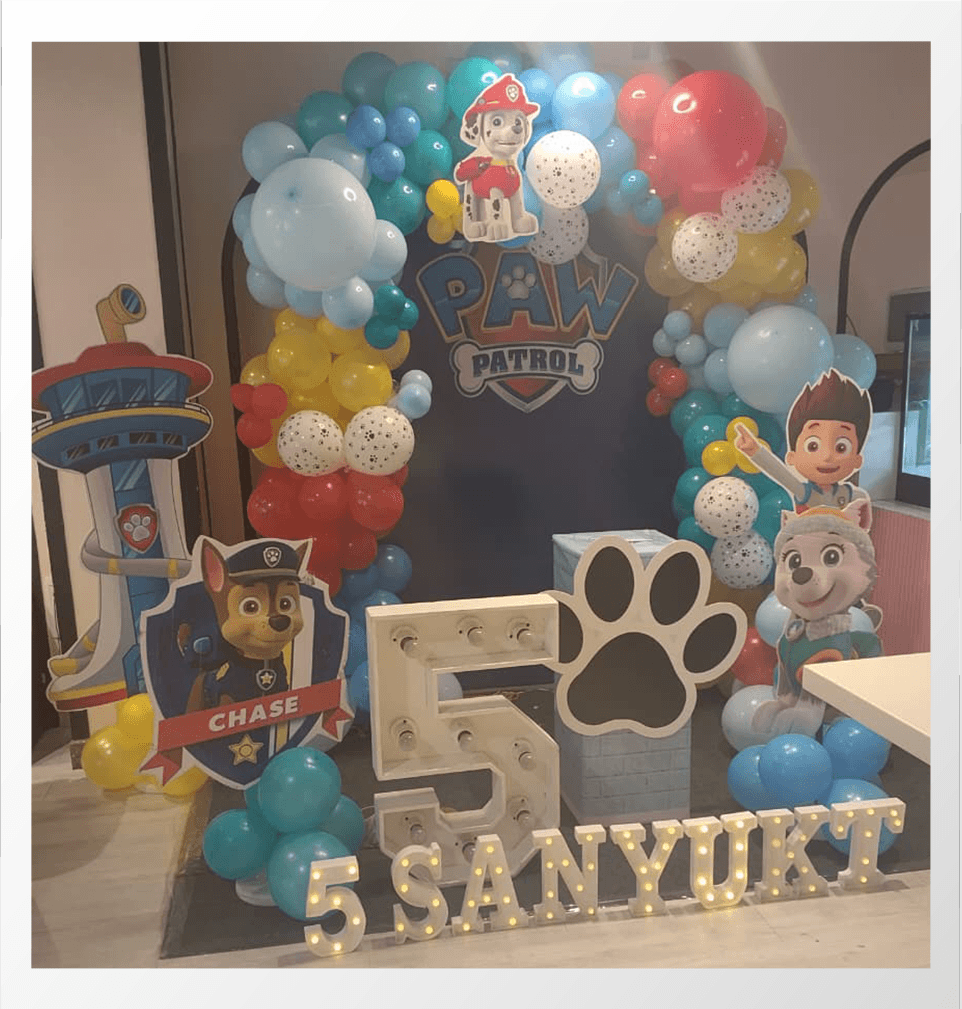 Kids birthday decoration with balloons and cake setup 8